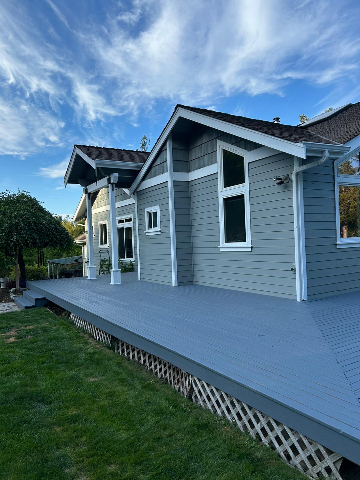 Deck staining project showing the finished wood surface