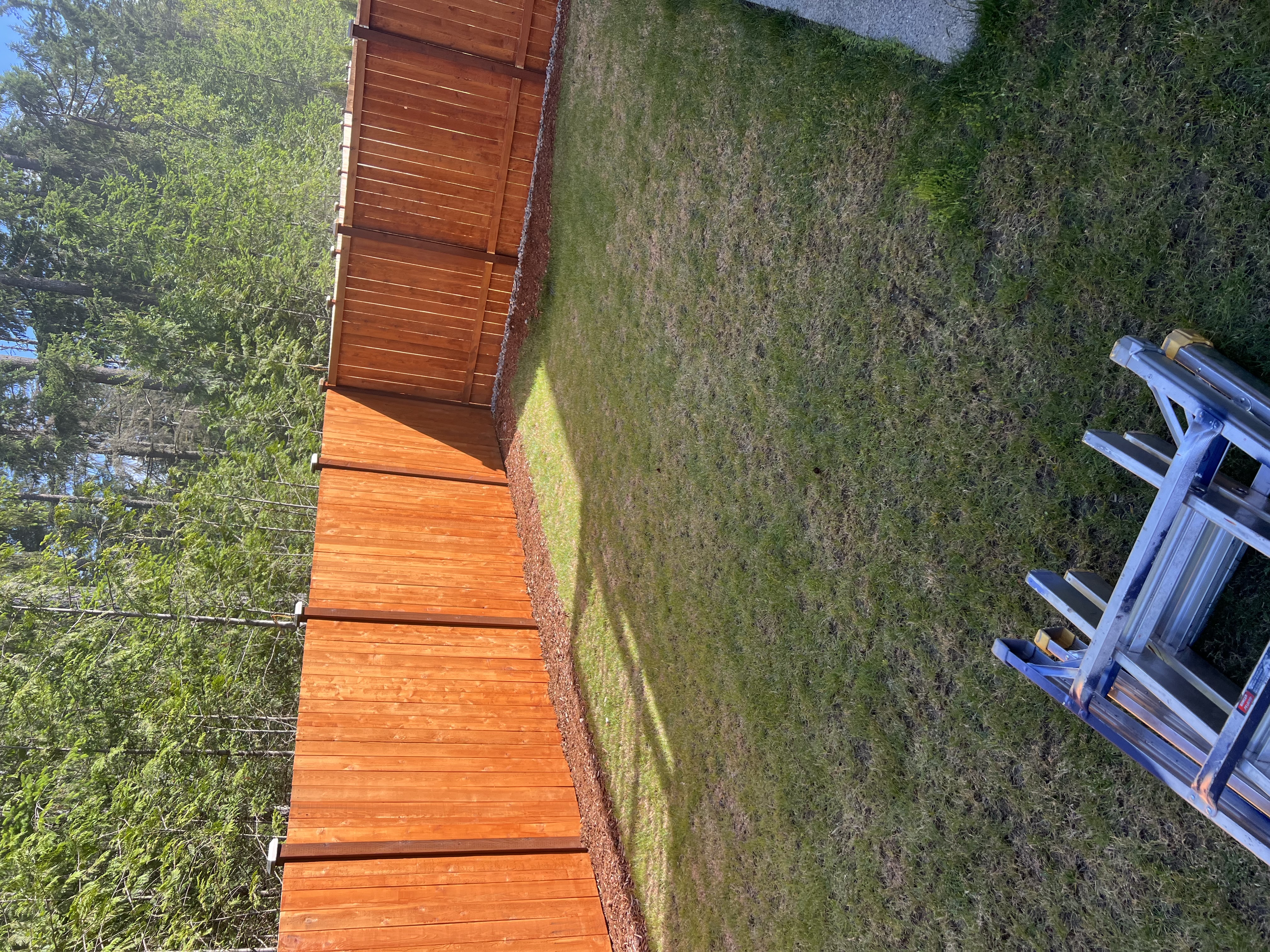 Wood fence staining by A2Z Painting and Construction